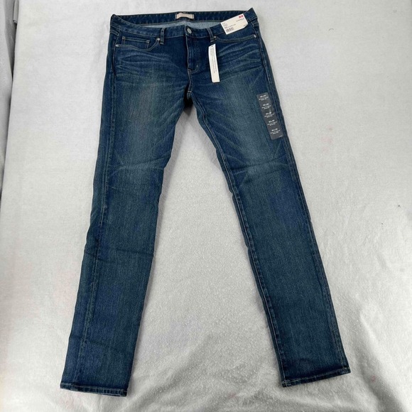 NWT UNIQLO Jeans Womens Dark Denim Blue Skinny Low Rise Tapered Stretch Sz 32x33 - Picture 1 of 7